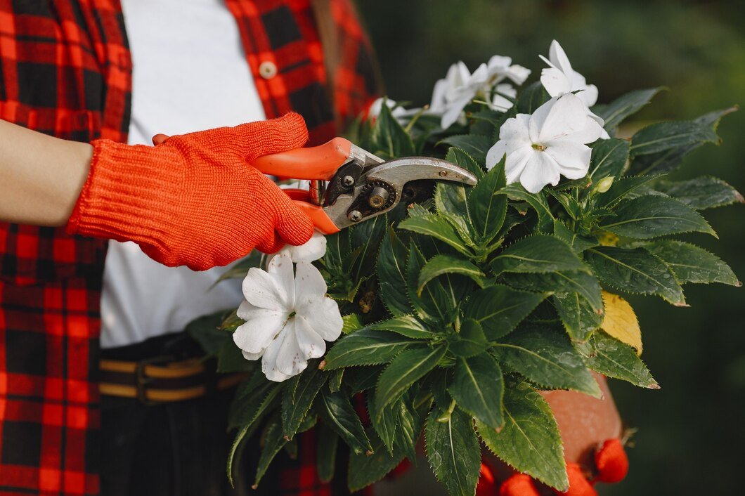 woman-red-shirt-worker-with-flowerpoots-daughter-with-plants_1157-41989